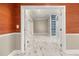 This flexible room features patterned walls and floors, with french doors that open to another room at 2983 Crosswycke Forest Ne Dr # A, Atlanta, GA 30319