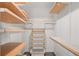 Spacious walk-in closet with custom shelving for optimal storage at 2983 Crosswycke Forest Ne Dr # A, Atlanta, GA 30319