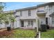 The back exterior with a small patio has easy outdoor access at 338 Saratoga Pl, Riverdale, GA 30296