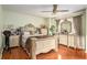 Spacious bedroom with wooden floors, ceiling fan, and neutral-colored furniture at 338 Saratoga Pl, Riverdale, GA 30296