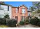 Charming townhome with brick facade, colorful shutters, and well-maintained landscaping at 338 Saratoga Pl, Riverdale, GA 30296