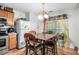 Charming eat-in kitchen with bright window and stylish table set at 338 Saratoga Pl, Riverdale, GA 30296