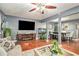 Spacious living room with fireplace, hardwood floors, and adjacent dining area at 338 Saratoga Pl, Riverdale, GA 30296