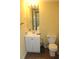 This bathroom has tile flooring, a modern vanity, and neutral yellow walls at 5627 Isleworth Ct, Atlanta, GA 30349