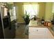 Bright dining area with natural light, tiled floors, and a view of backyard at 5627 Isleworth Ct, Atlanta, GA 30349