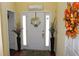 Warm and inviting foyer with decorative accents, a bright front door and wood floors at 5627 Isleworth Ct, Atlanta, GA 30349