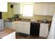 Efficient kitchen layout featuring essential appliances and practical countertop space at 5627 Isleworth Ct, Atlanta, GA 30349
