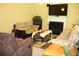 Comfortable living room with fireplace, large TV, and inviting seating arrangement at 5627 Isleworth Ct, Atlanta, GA 30349