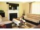 Cozy living space featuring a fireplace, a large TV, and comfortable seating arrangement at 5627 Isleworth Ct, Atlanta, GA 30349