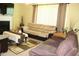 Comfortable living room with a fireplace, plush seating, and soft neutral tones at 5627 Isleworth Ct, Atlanta, GA 30349