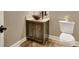 Powder room featuring a granite countertop, dark wood vanity and decorative vessel sink at 1689 Nebo Rd, Dallas, GA 30157