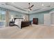 Carpeted main bedroom with a ceiling fan, windows, and furniture at 3669 High Green Dr, Marietta, GA 30068