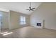 The living room features high ceilings, a fan, fresh paint and a white brick fireplace at 983 Oakwood Chase Cir, Stone Mountain, GA 30083