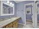 Bathroom with tile floor, single vanity and an additional room with toilet at 125 Bridget Dr, Hampton, GA 30228