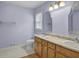Bathroom features tile floors, double vanity and a large mirror at 125 Bridget Dr, Hampton, GA 30228