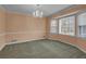 Bedroom featuring carpet floors, a ceiling fan, and a chandelier at 125 Bridget Dr, Hampton, GA 30228