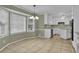 Eat in kitchen features white cabinets and tile flooring at 125 Bridget Dr, Hampton, GA 30228
