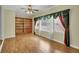 Spacious living room features hardwood floors, built-in shelving and lots of natural light at 125 Bridget Dr, Hampton, GA 30228