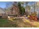 Well-maintained backyard with patio area, lush greenery, and mature trees at 2249 Chadds Creek Dr, Marietta, GA 30062