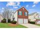 Charming brick and siding home with two-car garage, landscaped lawn on a sunny day at 2542 Albion Farm Way, Duluth, GA 30097