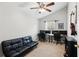 Office space featuring a futon, multiple monitors, and guitars hanging on the wall at 2542 Albion Farm Way, Duluth, GA 30097