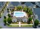 Aerial view of the community pool and clubhouse showcases an oasis for relaxation and social gatherings at 3785 Allegretto Cir # 230, Atlanta, GA 30339
