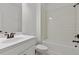 A bathtub and sink combo in a bathroom with white tiling at 3785 Allegretto Cir # 230, Atlanta, GA 30339
