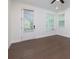 Bright bedroom features hardwood floors, natural light, and a private door to outdoor patio at 3785 Allegretto Cir # 230, Atlanta, GA 30339