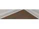 A hardwood floor with a light colored baseboard at 3785 Allegretto Cir # 230, Atlanta, GA 30339
