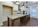 Modern kitchen features white cabinetry, stainless steel appliances, granite countertops, and ample natural light at 3785 Allegretto Cir # 230, Atlanta, GA 30339
