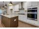 A spacious kitchen boasts granite countertops, stainless steel appliances and white cabinetry at 3785 Allegretto Cir # 230, Atlanta, GA 30339