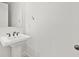 A powder room features a simple pedestal sink and a modern faucet at 3785 Allegretto Cir # 230, Atlanta, GA 30339