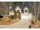 Charming two-story home with a well-maintained lawn, a two-car garage, and mature trees at 2695 Virginia Cv, South Fulton, GA 30296