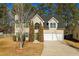 Charming two-story home with a well-maintained lawn, a two-car garage, and mature trees at 2695 Virginia Cv, South Fulton, GA 30296