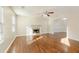 Inviting living room with a fireplace, ceiling fan, wood-look flooring, and natural light at 2695 Virginia Cv, South Fulton, GA 30296
