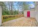 Wooden back deck perfect for entertaining, overlooking a lawn and mature trees at 1751 Twin Brooks Se Dr, Marietta, GA 30067