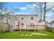 Green backyard featuring a deck, lawn, and partially fenced perimeter at 1751 Twin Brooks Se Dr, Marietta, GA 30067