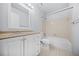 Clean bathroom featuring a shower-tub combo, white vanity, and neutral tile floor at 1751 Twin Brooks Se Dr, Marietta, GA 30067