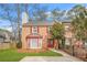 Charming brick townhouse with red shutters and a well-maintained front lawn at 1751 Twin Brooks Se Dr, Marietta, GA 30067