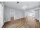 Open living area featuring hardwood floors, large windows, and a connecting room at 1751 Twin Brooks Se Dr, Marietta, GA 30067