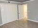 Bright bedroom featuring spacious closet with modern laminate flooring and freshly painted walls at 3083 Colonial Way # N, Atlanta, GA 30341