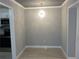 Dining room with modern light fixture and gray walls at 3083 Colonial Way # N, Atlanta, GA 30341