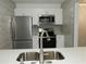 Renovated kitchen with stainless steel appliances and light countertops and cabinetry at 3083 Colonial Way # N, Atlanta, GA 30341