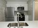 Kitchen with stainless steel appliances and white cabinets at 3083 Colonial Way # N, Atlanta, GA 30341