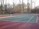 Community tennis court with trees and greenery in the background at 3083 Colonial Way # N, Atlanta, GA 30341