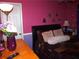 Charming bedroom boasts elegant decor, vibrant walls, and comfortable furnishings for a relaxing retreat at 3738 Windy Hill Se Dr, Conyers, GA 30013