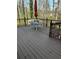 Exterior deck featuring wooden flooring and dark brown railings for outdoor enjoyment at 3738 Windy Hill Se Dr, Conyers, GA 30013