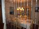 Elegant dining room with beautiful china cabinet and a table set for six at 3738 Windy Hill Se Dr, Conyers, GA 30013