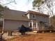 The backyard is a multi-story home with a deck and grilling area at 3738 Windy Hill Se Dr, Conyers, GA 30013