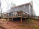 A large deck complements the house, ideal for outdoor entertaining and relaxation at 3738 Windy Hill Se Dr, Conyers, GA 30013